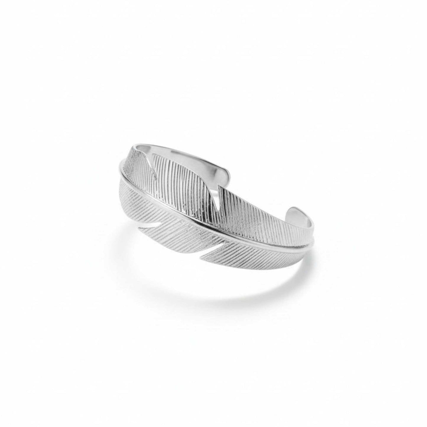 Silver feather-shaped cuff on a white background, Zephyr Cuff from House of Pehr