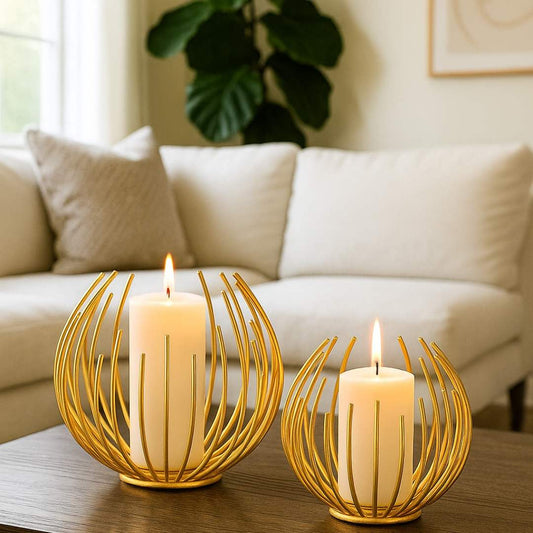Two Aura Candle Holders with lit candles on a table in a living room setting from House of Pehr