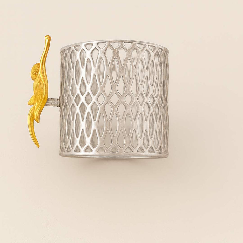 Blossom Napkin Rings - A set of napkin rings with silver and gold colors, featuring a floral design, displayed on a dining table from House of Pehr - Image 5