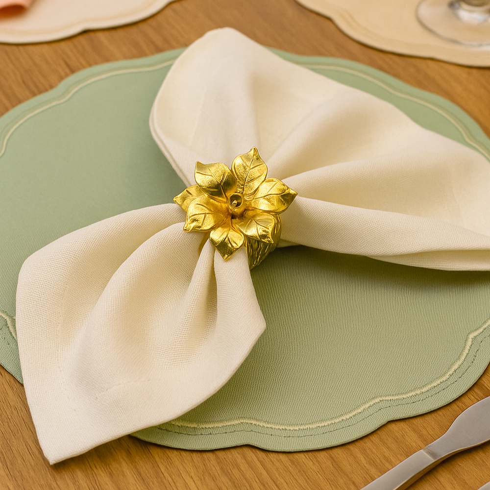 Blossom Napkin Rings - A set of napkin rings with silver and gold colors, featuring a floral design, displayed on a dining table from House of Pehr - Image 2