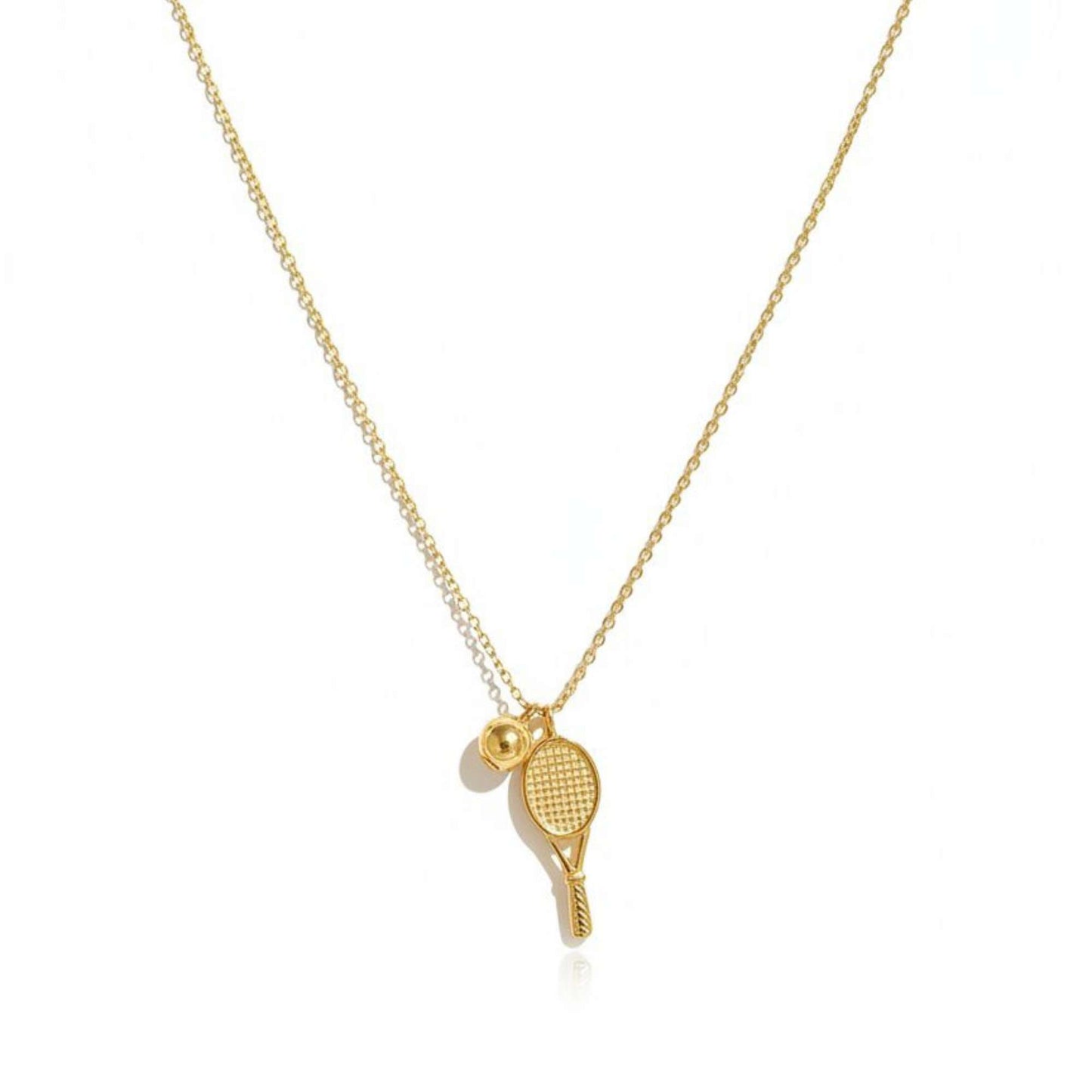 Gold necklace with tennis racket and ball pendant from House of Pehr