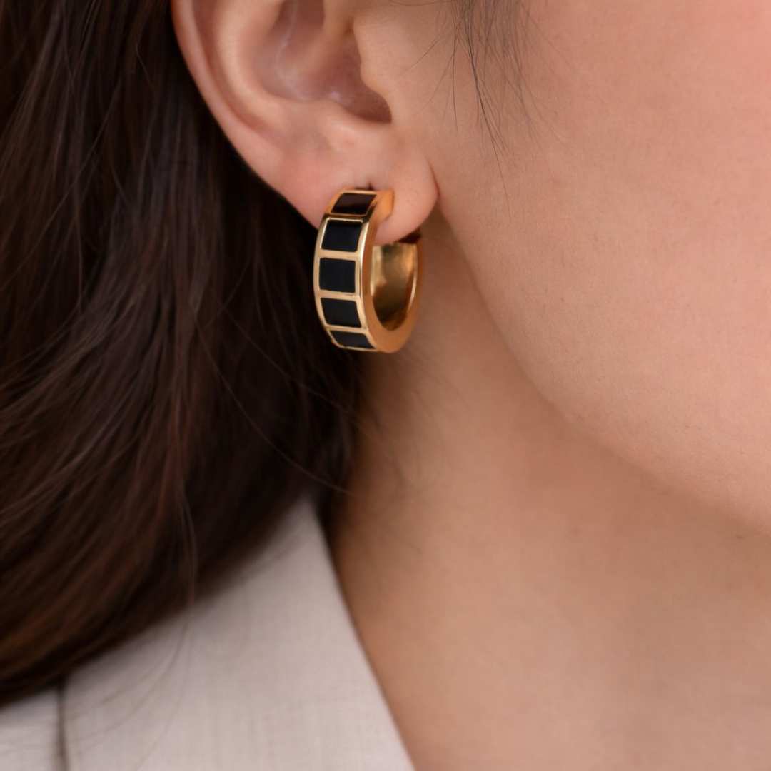Carra Gold hoops earrings with black square pattern from House of Pehr