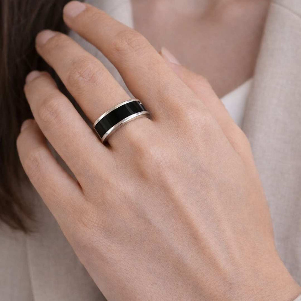 Hand wearing a black and gold ring on a light background - Noire Ring - house of pehr - Image 5