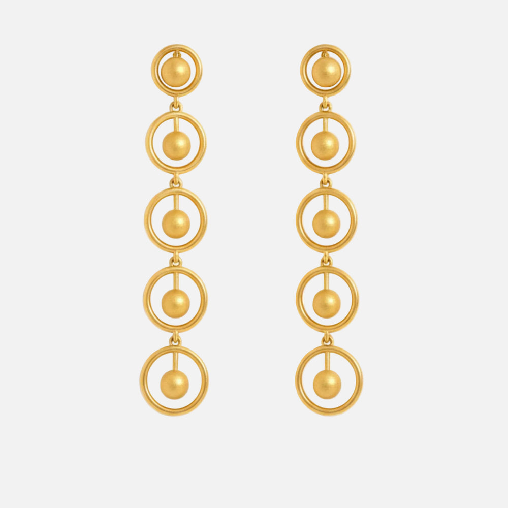 Gold earrings with circular design on a white background, solara earrings from house of pehr - Image 1
