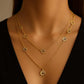 Orris Necklace from House of Pehr is a layered Gold plated necklace with peace symbol motifs 