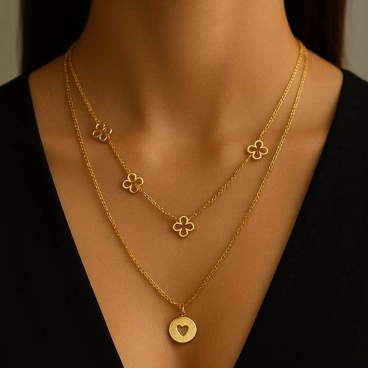 Amora Necklace from House of Pehr is a set of layered Gold plated necklaces with floral and heart motifs.