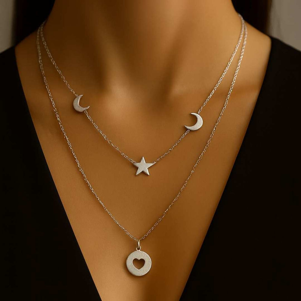 Celesta Necklace from House of Pehr is a layered set of Silver plated necklaces with moon, star, and heart Motifs. - Image 2