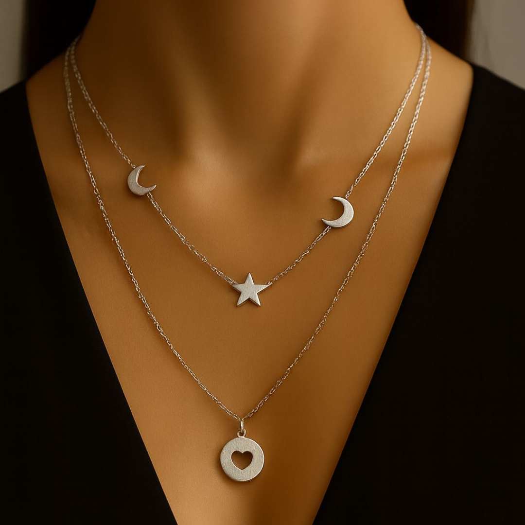 Celesta Necklace from House of Pehr is a layered set of Silver plated necklaces with moon, star, and heart Motifs.