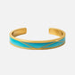 Gold bracelet with a blue band on a white background, Serena Bangles from House of Pehr