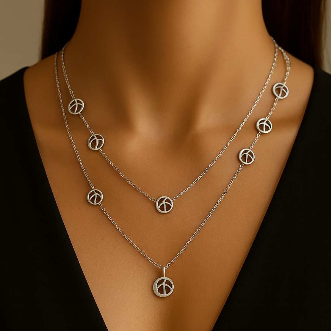 Orris Necklace from House of Pehr is a layered Silver plated necklace with peace symbol motifs 