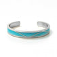 Silver bracelet with a blue band on a white background, Serena Bangles from House of Pehr