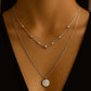 Elara Necklace with beads and circle charm from House of Pehr