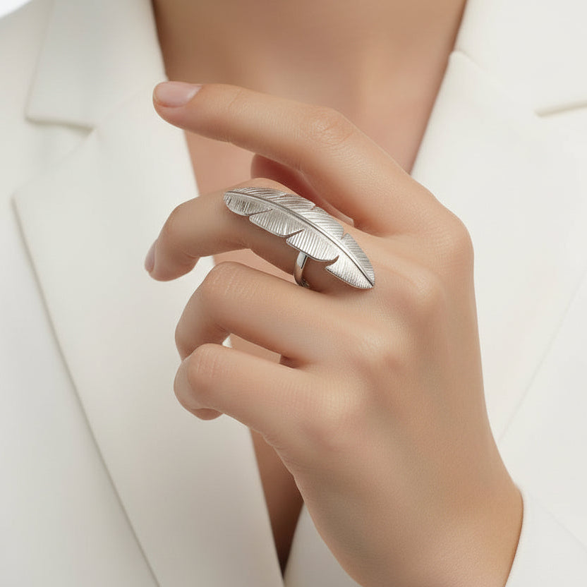 silver feather-shaped ring on a finger, Zephyr Ring from House of Pehr - Image 4