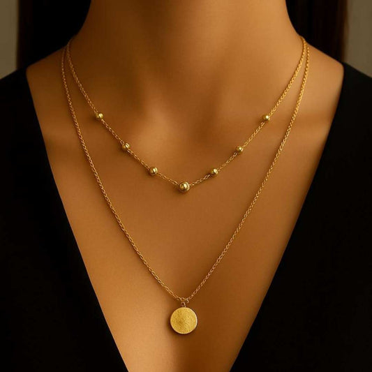 Elara Necklace with beads and circle charm from House of Pehr