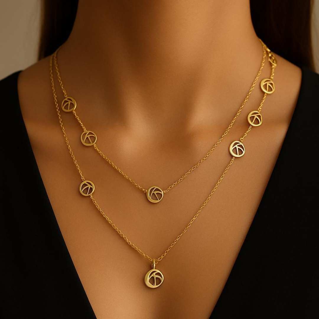 Orris Necklace from House of Pehr is a layered Gold plated necklace with peace symbol motifs 