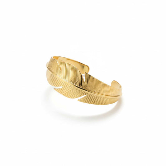 Gold feather-shaped cuff on a white background, Zephyr Cuff from House of Pehr
