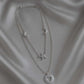 Celesta Necklace from House of Pehr is a layered set of silver plated necklaces with moon, star, and heart Motifs