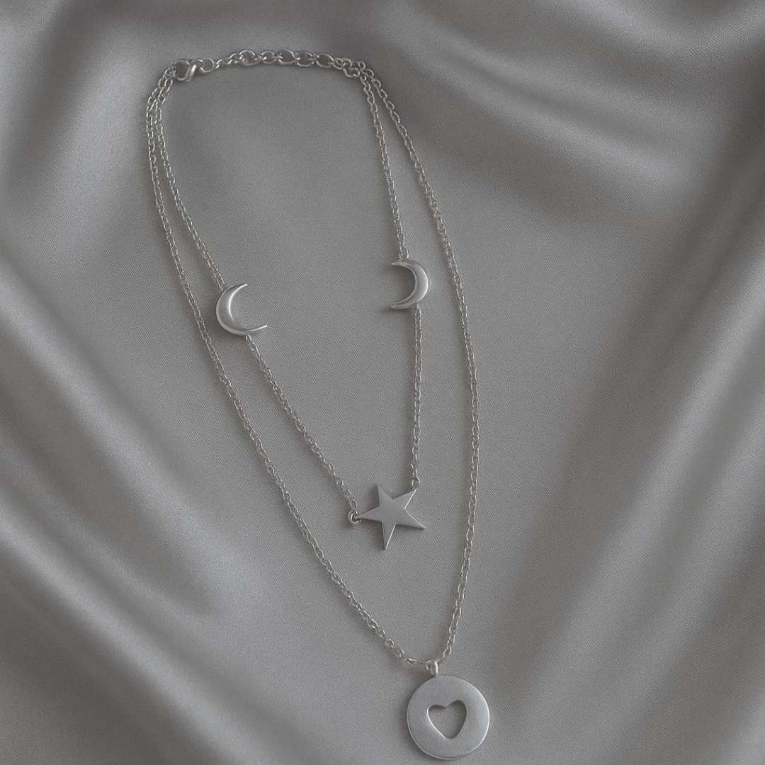 Celesta Necklace from House of Pehr is a layered set of silver plated necklaces with moon, star, and heart Motifs