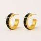 Carra Gold hoops earrings with black square pattern from House of Pehr