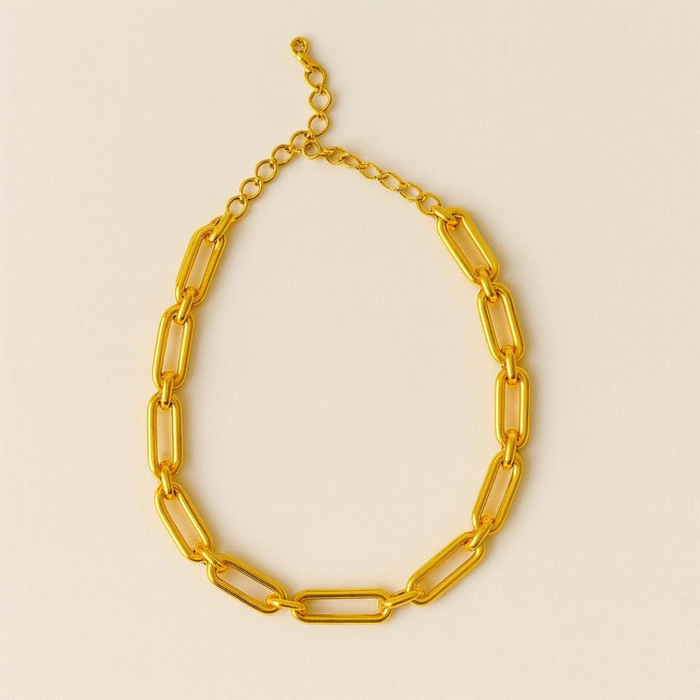 Numa Chain Gold necklace worn by a person in a beige suit against a neutral background from House of Pehr - Image 5