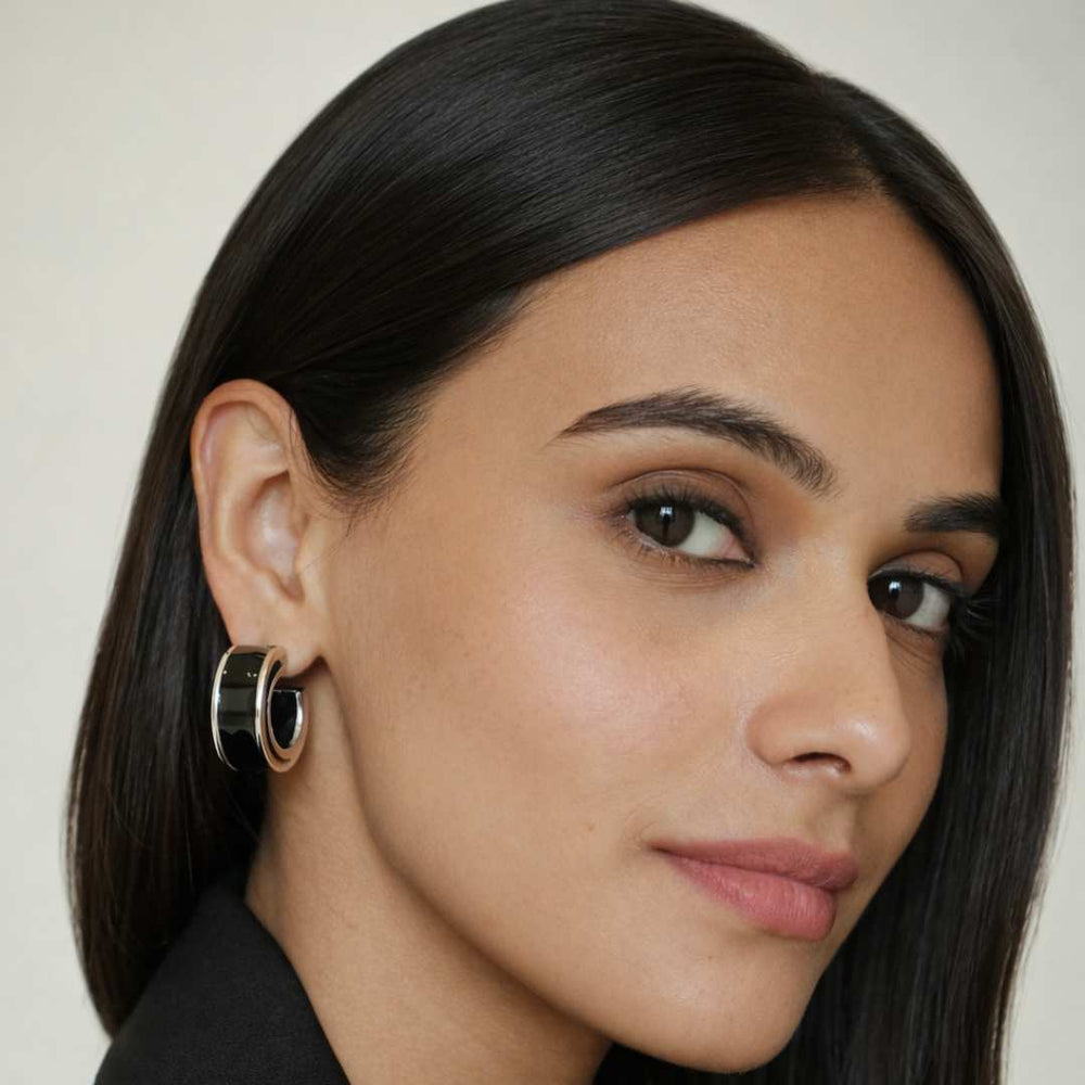 Close-up of a woman wearing an earring with a neutral background from House of Pehr - Image 3