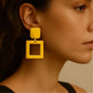 Numa Earrings are Golden geometric earrings from House of Pehr