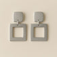 Numa Earrings are Silver geometric earrings from House of Pehr