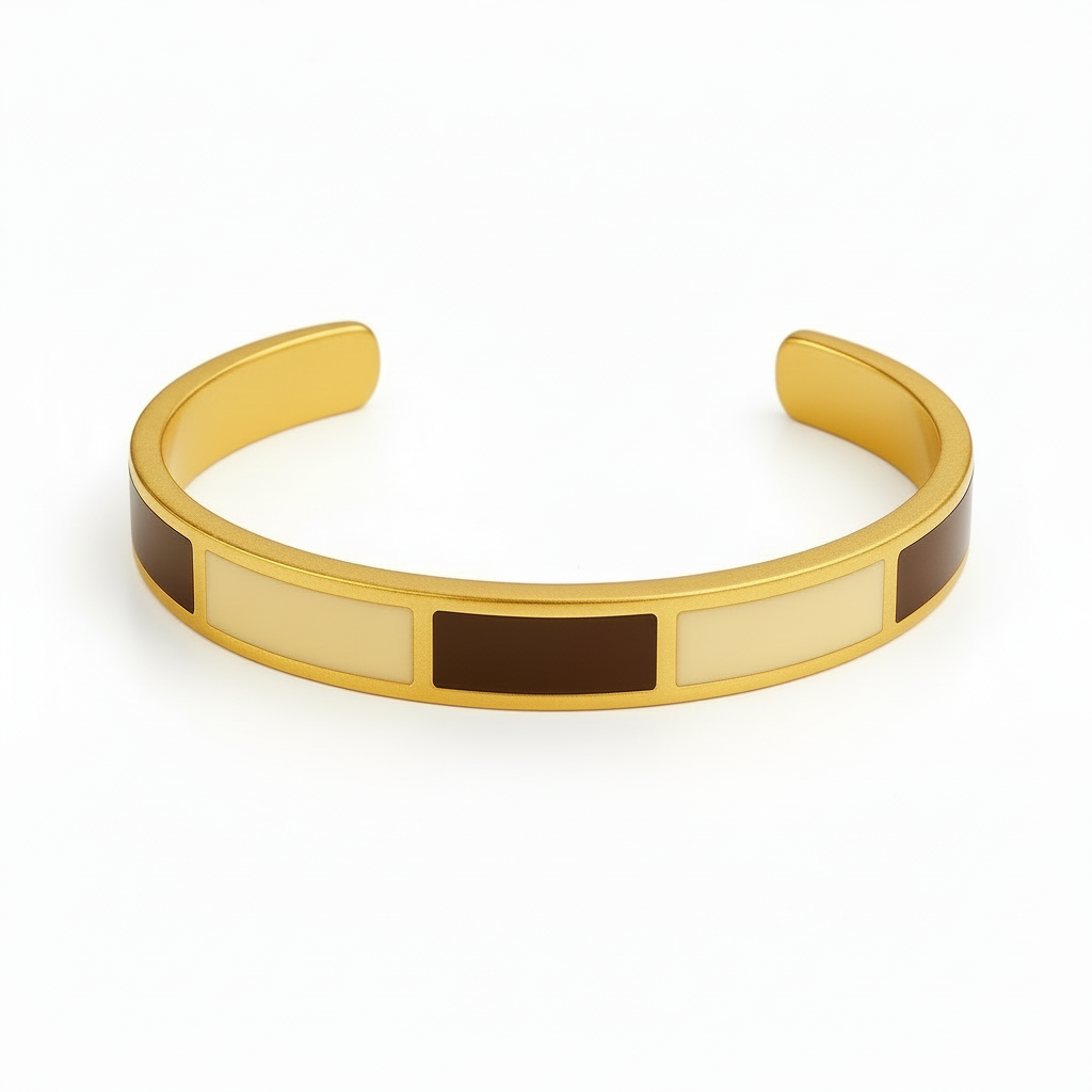 Dune Gold bangle with brown and beige accents on a light gray background