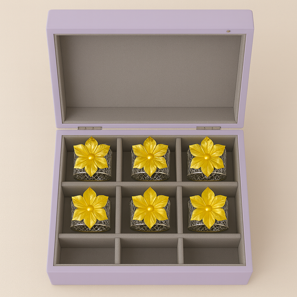 Blossom Napkin Rings - A set of napkin rings with silver and gold colors, featuring a floral design, displayed on a dining table from House of Pehr