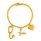 Gold bracelet with medical-themed charms on a white background. Aceso bracelet from house of Pehr 