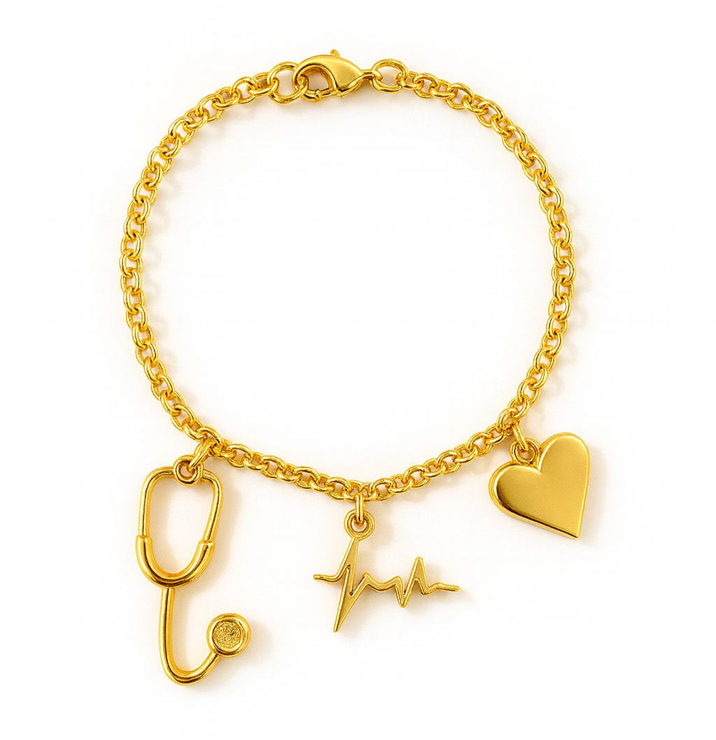 Gold bracelet with medical-themed charms on a white background. Aceso bracelet from house of Pehr 