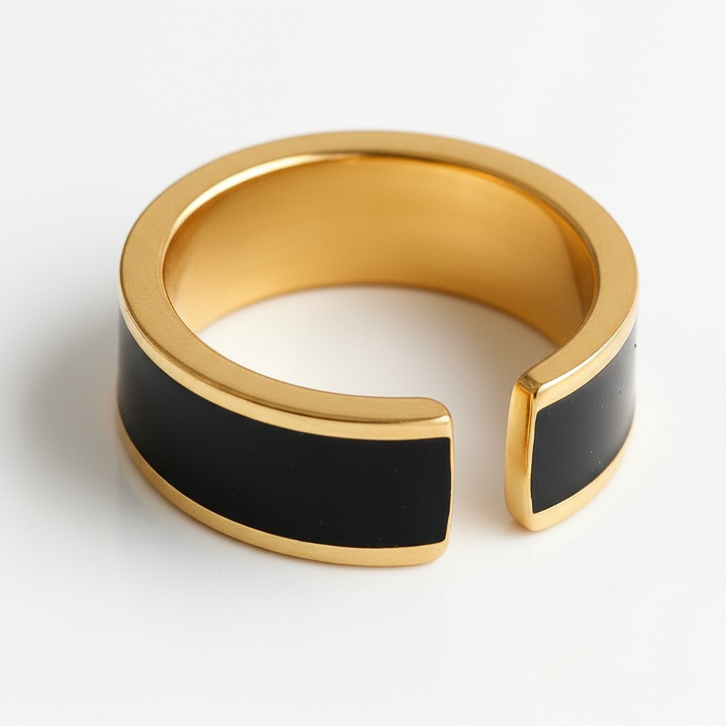 Gold and black ring on a white background