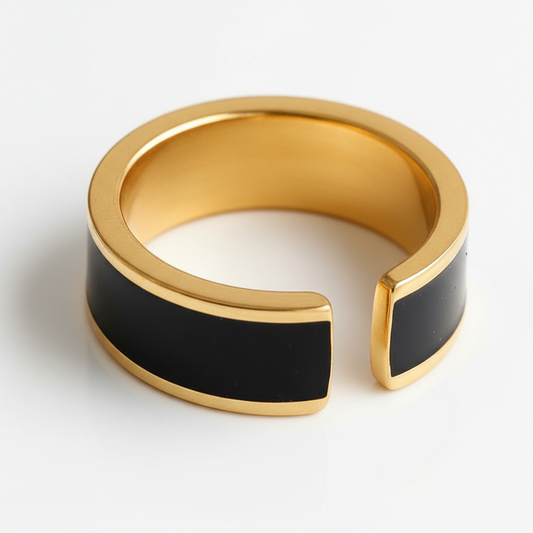 Gold and black ring on a white background