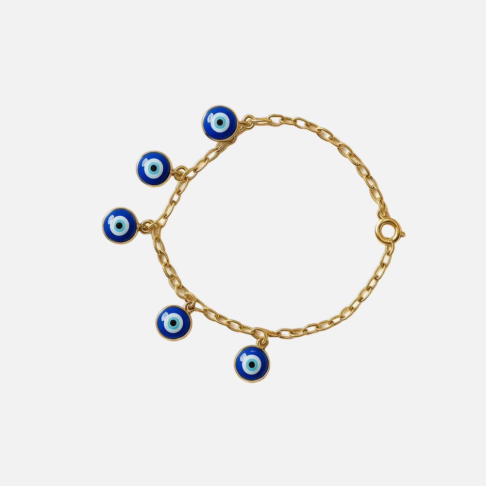Gold bracelet with blue evil eye charms on a white background from House of Pehr - Image 1